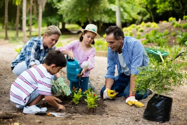 A young family working in the garden.