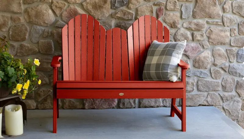 Red bench seat with pillow.