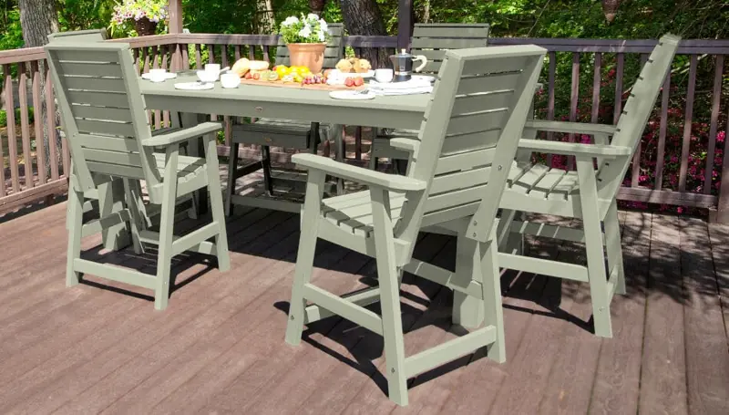 Outdoor dining set with tall tabvle and chairs.